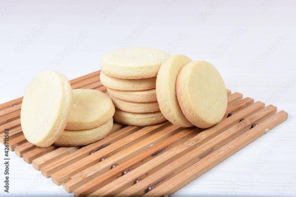 Butter cookies, on white wooden background