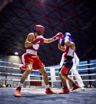 Two boxers fighting in a ring